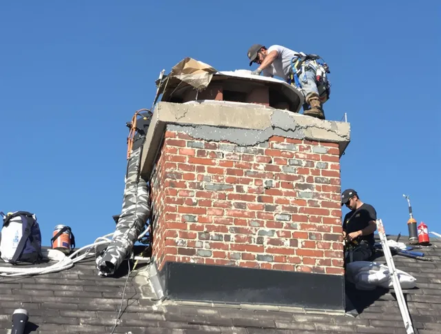 Gardena Chimney Sweep installing a custom chimney crown in Gardena, CA