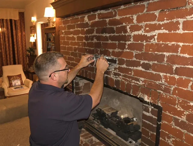 Gardena Chimney Sweep expert fixing a fireplace in Gardena, CA